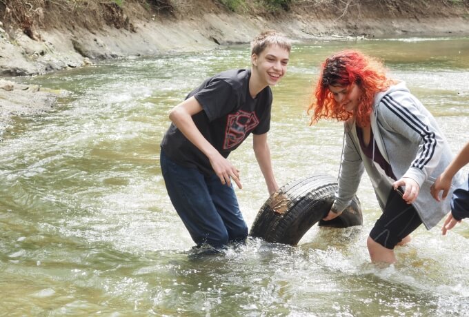 students helping keep creek healthy