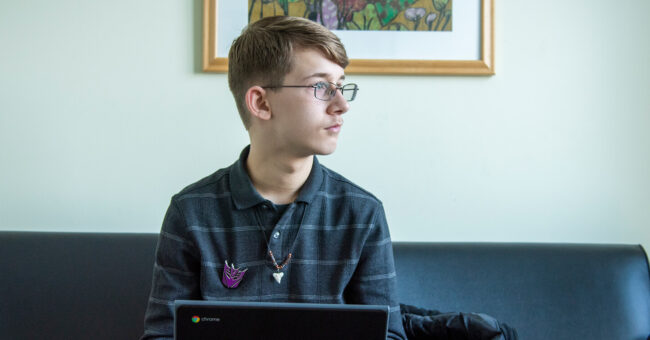 student looking out window