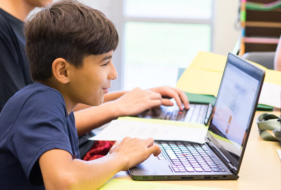 student working at laptop