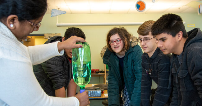 student in science class
