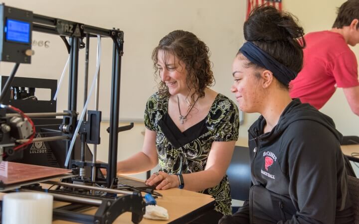 student and art teacher using 3d printing lab