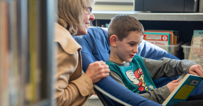 Teacher helping student