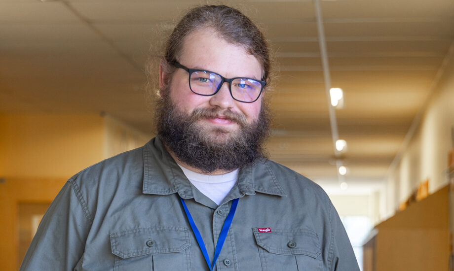 Teacher standing in a hallway