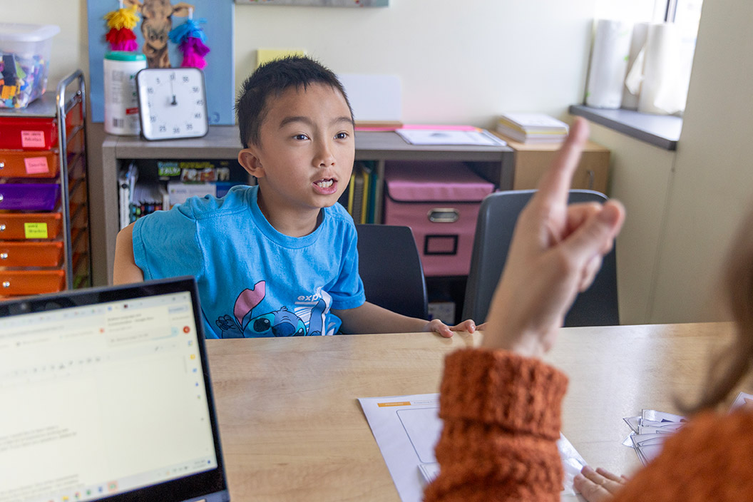 Janus student working with instructor on speech skills